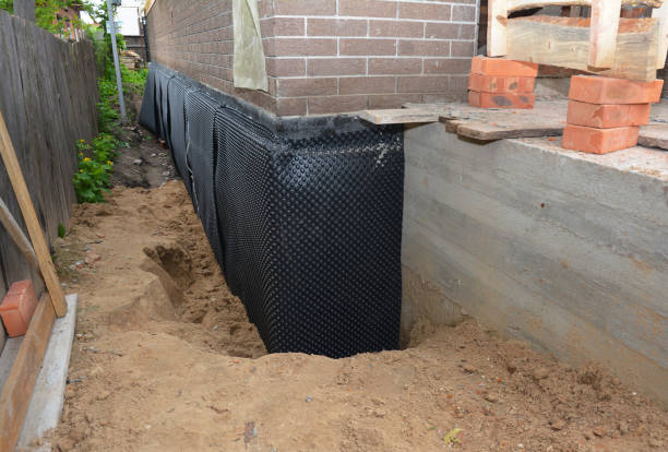 SJ Waterproofing Pros technician performing targeted Waterproofing assessment in Rothschild, WI